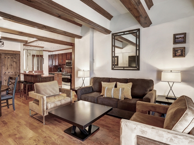 The kitchenette and lounge of a 2 bedroom suite at The Hythe Vail CO